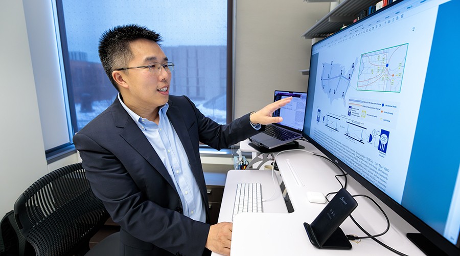 Liang Jiang at his computer